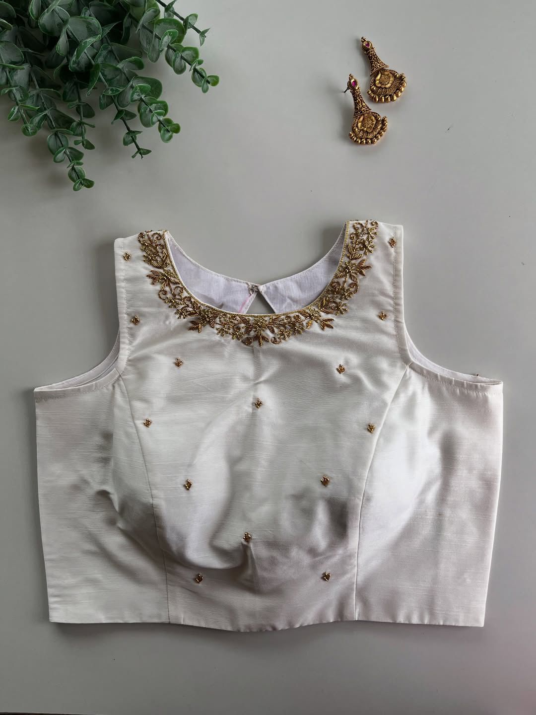 Step into elegance with this stunning designer Raspberry silk blouse, richly decorated