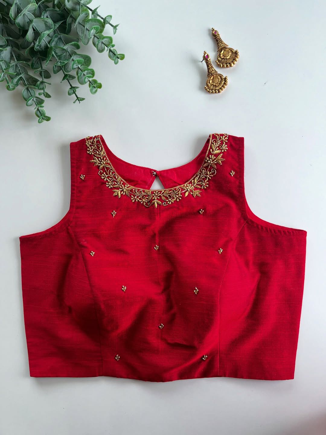 Step into elegance with this stunning designer Raspberry silk blouse, richly decorated with